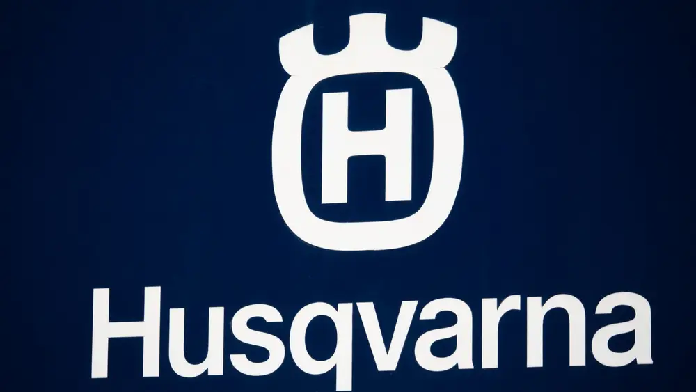 Husqvarna logo displayed during coverage of a class action settlement over recalled trimmers